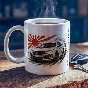 May include: White ceramic coffee mug with a car graphic and Japanese rising sun design. The mug features a detailed illustration of a car in front of a red sunburst. Steam rises from the dark liquid inside the mug.