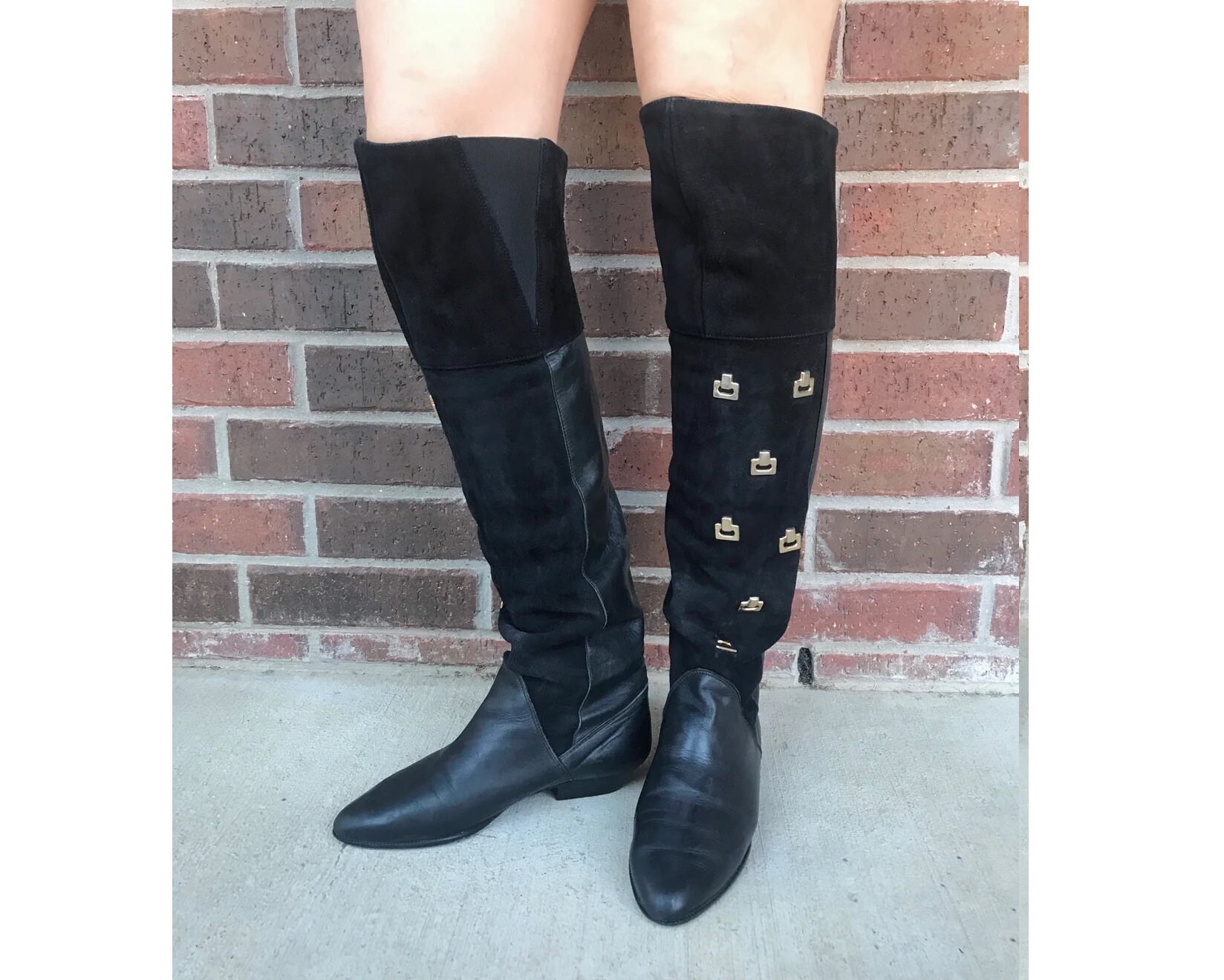 black boots gold hardware