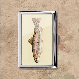 May include: A set of three ceramic mugs with a speckled, matte finish. The mugs are in shades of cream, light gray, and dark gray. Each mug has a simple, minimalist design, perfect for coffee or tea.