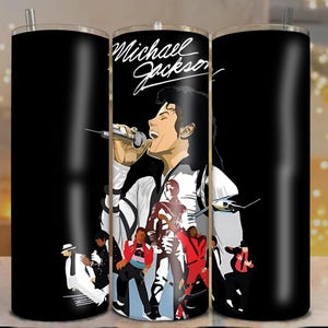 May include: Black tumbler featuring a graphic of Michael Jackson singing into a microphone, with the text "Michael Jackson" in white script. The design includes illustrations of Jackson in various outfits and poses. The tumbler has a silver straw.