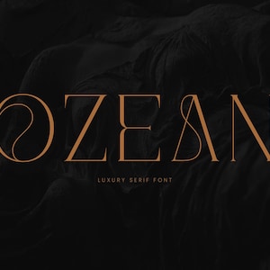 May include: A dark background with the word "OZEAN" in a copper-colored serif font. Below the word is the text "LUXURY SERIF FONT". The letter "O" has a unique swirl design.