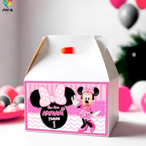 May include: White party favor box with a pink and black Minnie Mouse design. The box features a pink polka dot bow, Minnie Mouse illustration, and text that reads "Our little Armani turns 1."