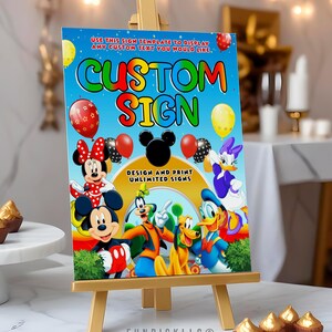 a sign with a mickey mouse poster on it