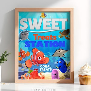 May include: A framed poster with the words "SWEET Treats STATION" in white, orange, and blue. The poster features cartoon images of fish and sea creatures. The words "CORAL TREATS" are also visible. The frame is a light brown color.