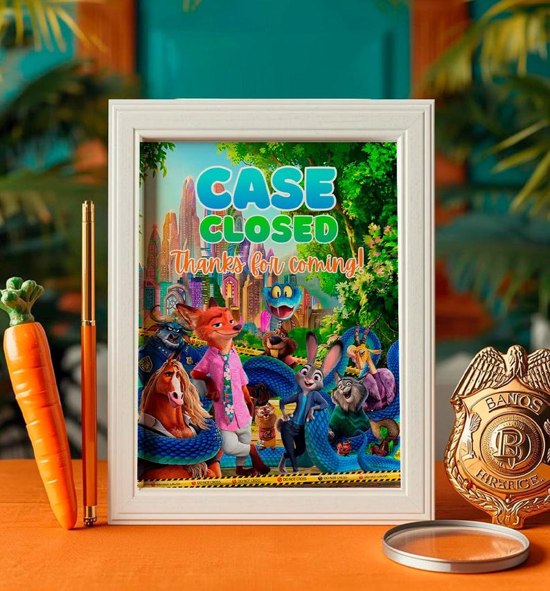 a framed poster with a colorful illustration of cartoon animals, including a police officer, on a table.