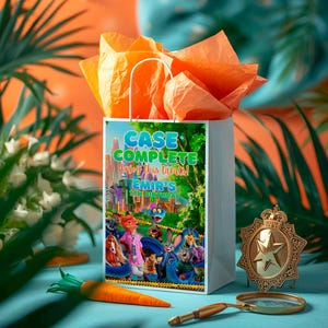 a white gift bag with a colorful illustration of cartoon characters, placed on a table with a magnifying glass and a carrot.