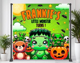 May include: A colorful Halloween-themed backdrop featuring a cartoon Frankenstein's monster with the text "Frankie's Little Monster Turns 1". The design includes pumpkins, bats, stars, and teddy bears in a vibrant green and orange color scheme.