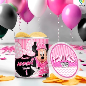 May include: A pink and white Minnie Mouse-themed potato chip container with the text "Our Little Armani Turns 1." The container is next to a pile of chips and a lid that says "Potato Chips Original Flavor."