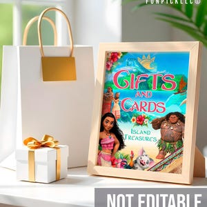 a picture frame sitting on top of a table next to a gift bag
