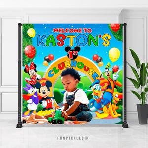 May include: A colourful backdrop for a first birthday celebration, with the text "Welcome to Kaston's 1st Clubhouse." The design incorporates cartoon characters, balloons, and a child playing with a toy truck.