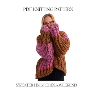 May include: A brown and purple chunky knit sweater. The sweater has a ribbed texture with purple sleeves and accents. The text "PDF KNITTING PATTERN" and "SWEATER FINISHED IN A WEEKEND" are displayed. The size is "S".