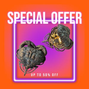 May include: Two heart-shaped objects with a dark, weathered bronze finish and a sculpted face on the front. One object is closed, while the other is open, revealing a gold-coloured internal mechanical music box mechanism. Text reads SPECIAL OFFER UP TO 50% OFF.