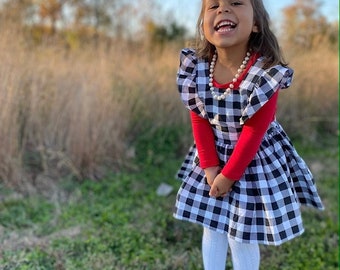 2 piece Buffalo plaid pinafore dress with included long sleeved red tee