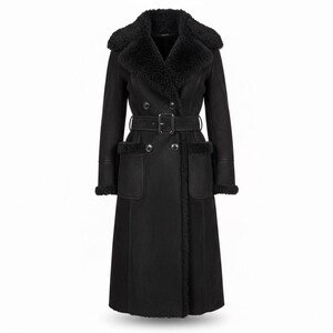 May include: A long, black coat with a shearling collar and cuffs. The coat features a double-breasted design, a belt at the waist, and two front pockets. The coat is made of a soft, textured material.