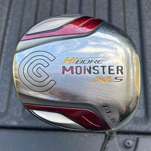 May include: A silver golf club head with red accents and the text "HiBORE MONSTER XLS" in yellow and white. The club has a large "G" logo and the number "11.5" is visible.