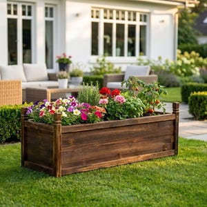 Outdoor wooden planter box on patio ready for vegetable planting