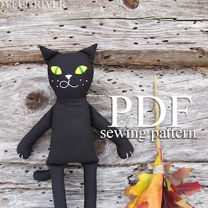 May include: A black cat sewing pattern, with a black cat doll and a broom made of fall leaves. The pattern is a PDF download.
