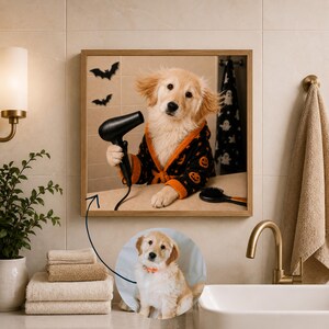 May include: A square framed wall art piece featuring a golden retriever puppy wearing a black bathrobe with orange pumpkin patterns, holding a black hair dryer. A smaller circular inset shows the same puppy wearing an orange collar.