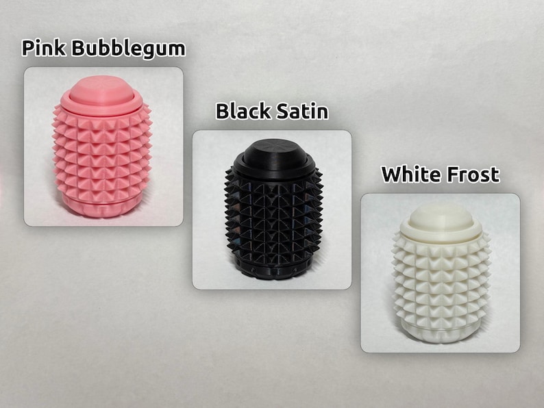 May include: Three cylindrical objects with a textured, spiked surface and a smooth top cap. The items are labeled Pink Bubblegum in pink, Black Satin in black, and White Frost in white. Each object features a repeating pyramid stud pattern.