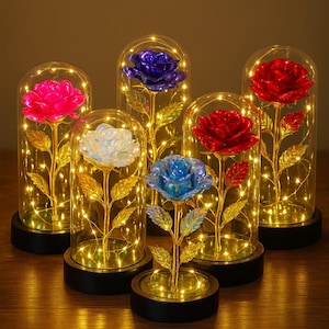 May include: Six decorative roses in glass domes with LED lights. The roses are in various colours, including pink, blue, and red. The stems and leaves are gold-coloured, and the bases are black.
