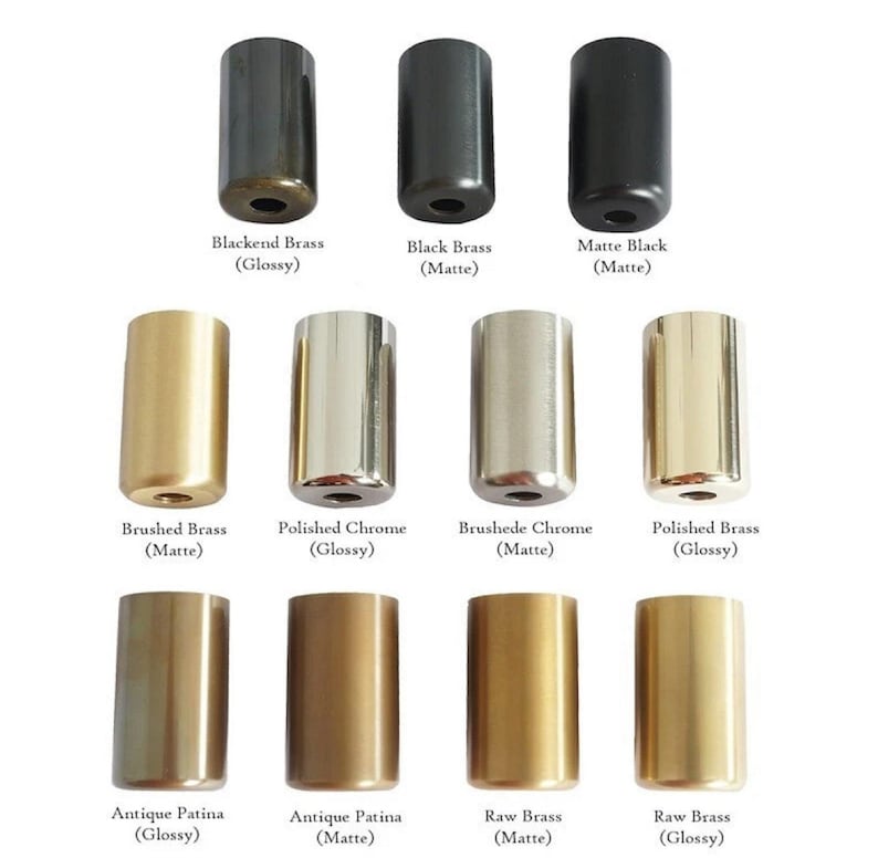 May include: An assortment of cylindrical metal hardware in various finishes, including black, brass, and chrome. The image displays samples labeled "Blackend Brass," "Black Brass," "Matte Black," "Brushed Brass," "Polished Chrome," "Brushede Chrome," "Polished Brass," "Antique Patina," and "Raw Brass."