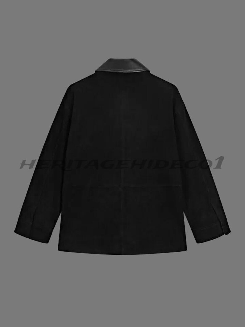 May include: Black jacket with a leather collar. The jacket has long sleeves and a classic design. The text "HERITAGEHIDECO1" is printed across the bottom of the jacket.