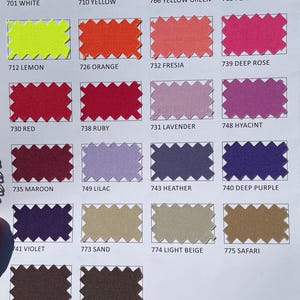 May include: A color chart featuring fabric swatches in various shades. The swatches are labeled with numbers and color names, including white, yellow, green, orange, red, purple, and brown. The image is well-lit, showcasing the diverse color palette.