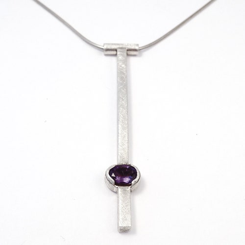 Silver square tube pendant with faceted amethyst