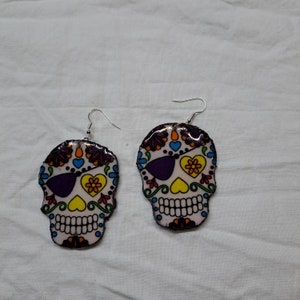 Sugar Skull earrings, great for Halloween or Day of the Dead. Hand-created with fabric, paper, and resin. Each pair unique and lightweight