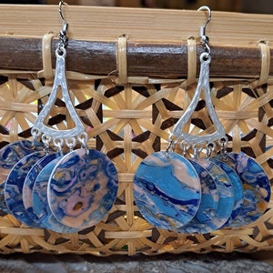 blue disc dangle. catching the sun, catching an eye. Great statement earrings, they speak volumes with out being overpowering