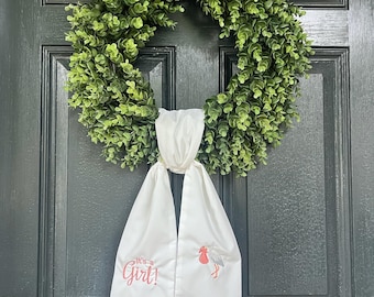 Banda de corona para anunciar el nacimiento del bebé