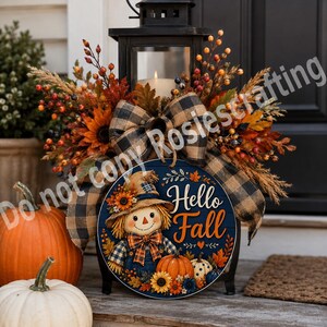 Pumpkin and scarecrow wreath sign with sunflower accents, berries, orange leaves, and farmhouse fall style.