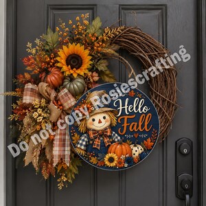 Round autumn door decor with cheerful scarecrow, plaid details, pumpkins, leaves, and seasonal flowers.