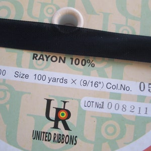 May include: A spool of black rayon ribbon with the text "RAYON 100%", "No. 6500", "Size 100 yards x (9/16")", "Col.No. 055", "LOT No1 0082111", and "UNITED RIBBONS".