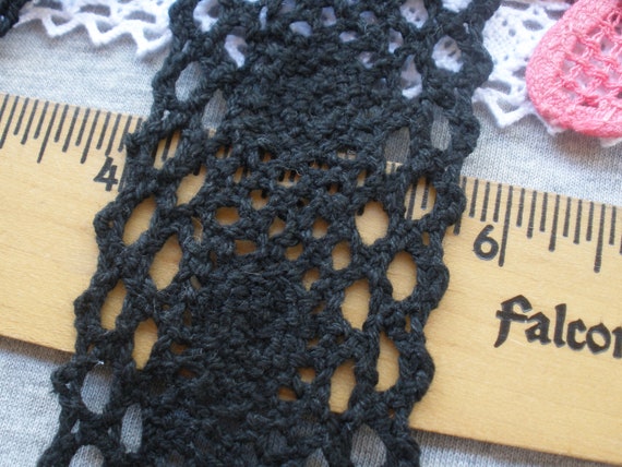 2 yards of black crochet clunny with an insert of black ribbon