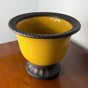 May include: A set of three ceramic mugs with a speckled, matte finish. The mugs are in shades of cream, light gray, and dark gray. Each mug has a simple, minimalist design, perfect for coffee or tea.