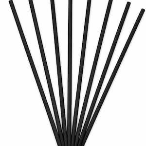 May include: Eight thin, straight, black cylindrical sticks arranged in a fan-like pattern. Each stick has a uniform diameter and a matte texture, radiating outward from a single point at the bottom to create a symmetrical, linear display.