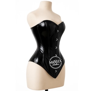 May include: Black corset with a shiny, faux leather appearance. The corset has a strapless design with a sweetheart neckline and a series of small silver-colored clasps down the front. The corset is displayed on a mannequin. The logo "MØSIX Fashion" is visible.