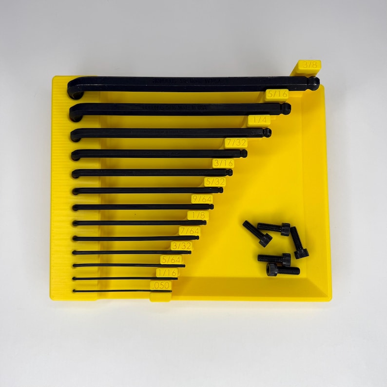 Top-down view of a yellow 3D-printed Bondhus inch Allen wrench organizer tray containing 13 black hex keys. The tray features a built-in magnetic parts area on the right with several black socket head screws. Each wrench slot is labeled with embossed inch sizes from .05" to 3/8".