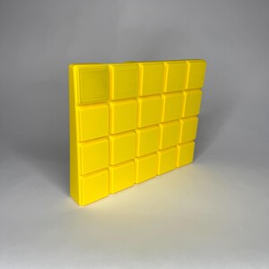 Bottom view of a yellow 3D-printed Bondhus inch Allen wrench organizer featuring Gridfinity 42mm.