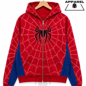 Peut inclure: Un sweat à capuche zippé rouge avec un emblème d'araignée noir sur la poitrine et un motif de toile d'araignée rouge clair sur le devant et le dos. Le vêtement comprend des panneaux latéraux bleus, des manches longues, une capuche et une fermeture éclair.