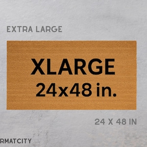 May include: An extra-large doormat with the text "XLarge 24x48 in." in black. The doormat is rectangular and made of a light brown material. The words "EXTRA LARGE" are above the doormat, and "24 X 48 IN" is below it.
