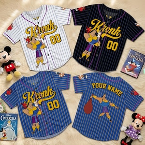 May include: Four baseball jerseys with the character Kronk from The Emperor's New Groove. The jerseys are white, black, and blue with yellow lettering and the number 00. One jersey has "Your Name" on the back.