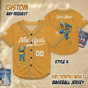 May include: Mustard yellow baseball jersey with blue accents and a comic book character graphic. The jersey features the name "Neal Leeds" and the number "00". Text on the jersey reads "CUSTOM ANY REQUEST" and "KID/YOUTH/ADULT BASEBALL JERSEY".