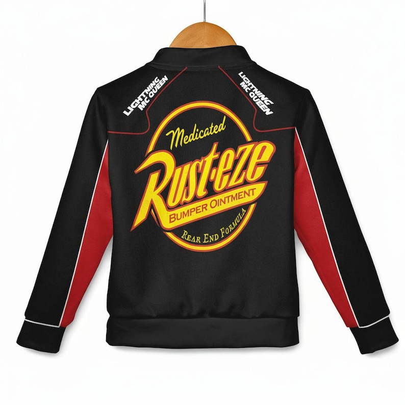 May include: Black zip-up jacket with red and white accents. The back features a large yellow and red "Rust-eze" logo with the text "Medicated Bumper Ointment" and "Rear End Formula". The sleeves have red stripes.