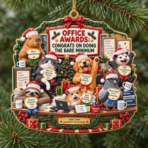 May include: A decorative holiday ornament featuring a group of animals in an office setting with the text OFFICE AWARDS: CONGRATS ON DOING THE BARE MINIMUM. The scene includes a capybara, cat, dog, sloth, hamster, opossum, and pigeon with award signs.