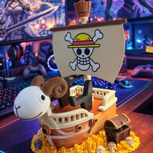 May include: A detailed figurine of the Going Merry ship from the anime series One Piece. The ship is brown and white, with a sail featuring a skull and crossbones. It sits on a base of gold coins and includes a treasure chest and skulls.