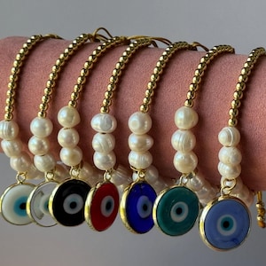 Pulseras ajustables con ojo turco de vidrio.