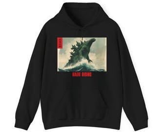 May include: Black hoodie with a graphic of a green monster emerging from the sea, with the text "RADU RISING" beneath. The design includes Japanese text in a red box. The hoodie has a front pocket and a drawstring hood.