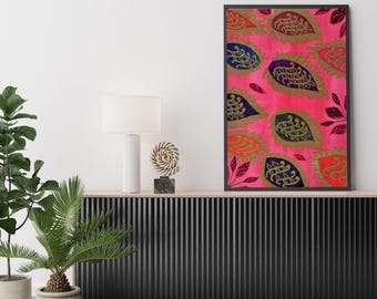 May include: A rectangular wall art print featuring a vibrant pink background decorated with a repeating pattern of stylized leaf shapes in shades of dark blue, gold, and orange, all enclosed within a thin black frame hanging on a wall.